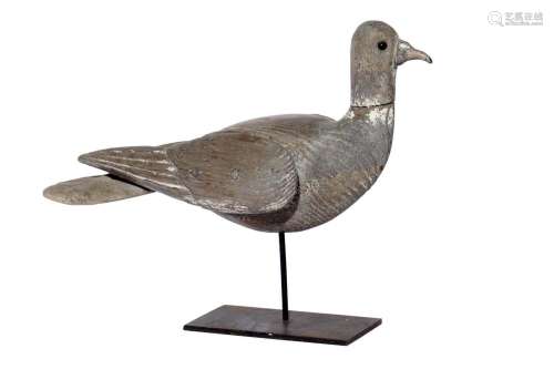 A CARVED AND POLYCHROME OAK PIGEON DECOY