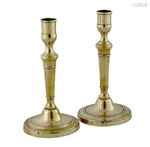 A PAIR OF GEORGE III BRASS CANDLESTICKS