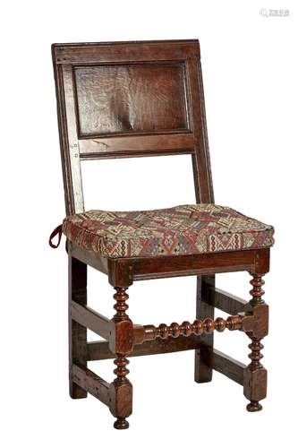 A JACOBEAN OAK BACK STOOL