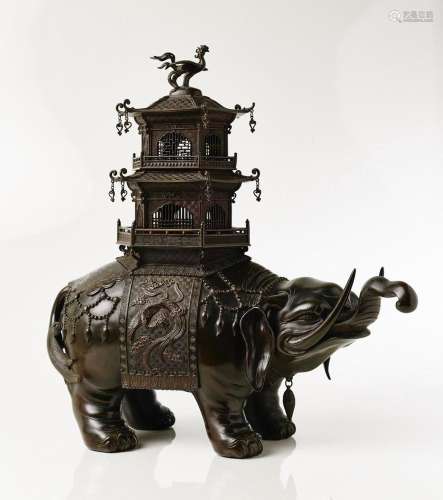 A JAPANESE BRONZE KORO IN THE FORM OF A CAPARISONED ELEPHANT...