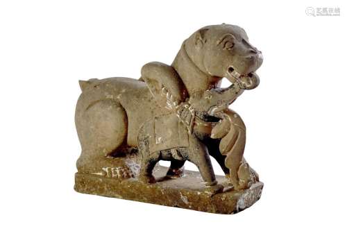 AN INDIAN BUFF SANDSTONE CARVING OF A LION AND AN ELEPHANT