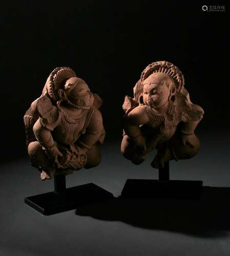 A PAIR OF INDIAN RED SANDSTONE FIGURES OF CELESTIAL MUSICIAN...