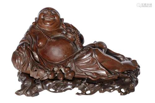 A CHINESE BOXWOOD CARVING OF THE RECLINING BUDDHA