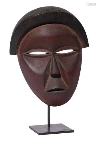 AN AFRICAN CARVED WOOD TRIBAL MASK