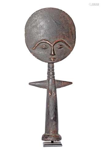 A GHANAIAN CARVED WOOD AND LACQUERED ASHANTI DOLL