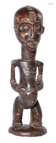 AN AFRICAN TRIBAL CARVED WOOD FIGURE OF A WOMAN