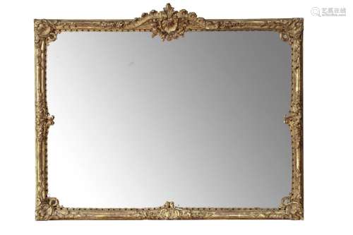 AN EARLY LOUIS XV CARVED AND GILTWOOD MIRROR