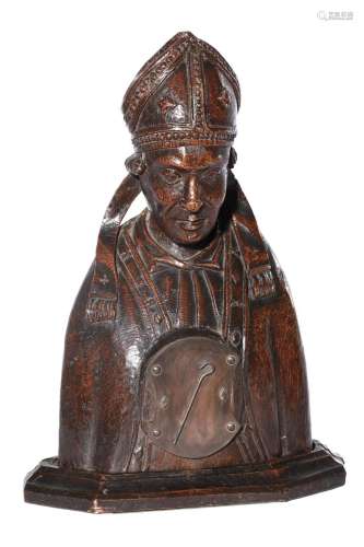 A CARVED OAK RELIQUARY IN THE FORM OF A BISHOP SAINT