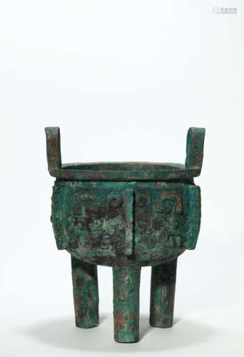 A Bronze Ritual Taotie Tripod Ding Vessel