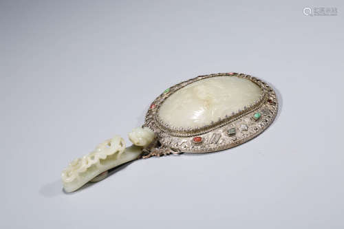 A Carved White Jade Mirror
