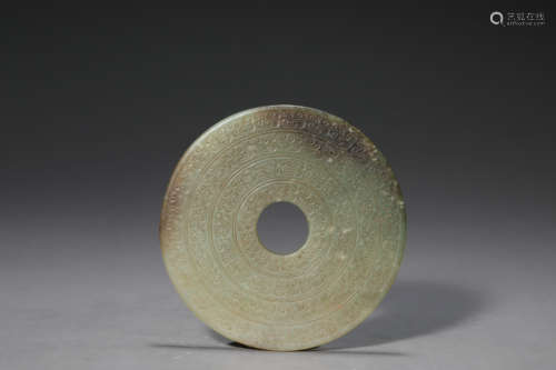 A Carved Celadon Jade Disc Bi