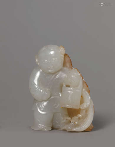 A Carved Buff Jade Boy Ornament