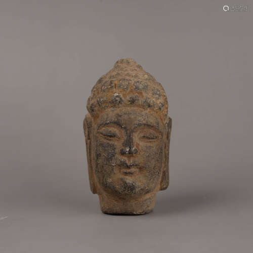 A Carved Stone Head of Buddha