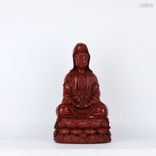 A Carved Cinnabar Lacquer Figure of Guanyin