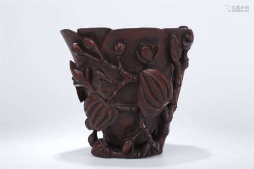 An Agarwood Horn Cup with Flowers Design.