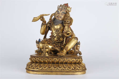 A Gilt Copper Mahasiddha Buddha Statue.