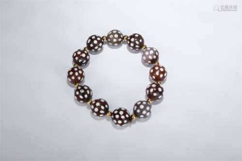 A Bracelet of Agate Beads.