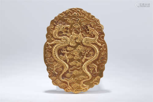 A Gilt Copper Token with Dragon Design.