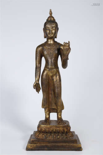 A Gilt Copper Standing Sakyamuni Buddha Statue