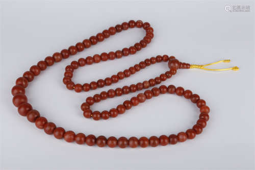 A String of Nanjiang Red Agate Beads.