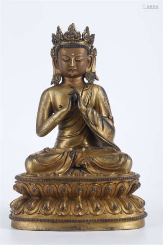 A Gilt Copper Vairocana Buddha Statue.
