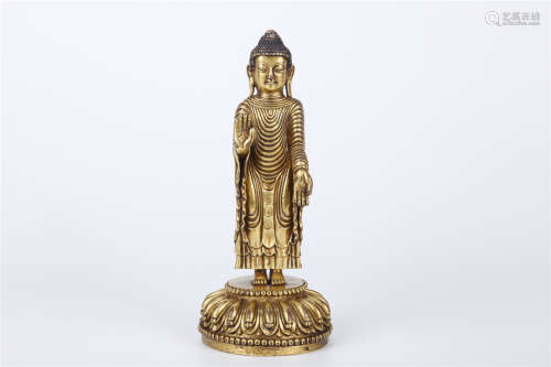 A Gilt Copper Standing Zhantan Buddha Statue