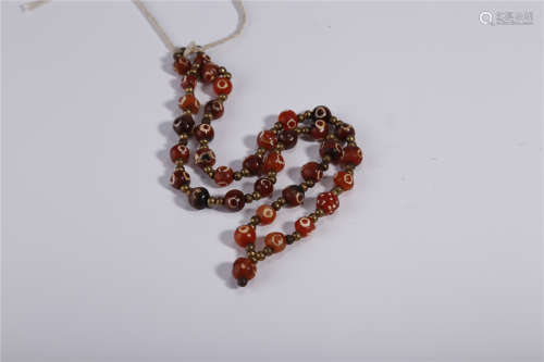 A Necklace of Agate Beads.