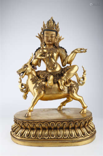 A Gilt Copper Kylin Buddha Statue.