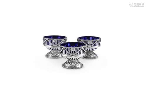 A MATCHED SET OF THREE GEORGE III SILVER OVAL PEDESTAL SALT ...