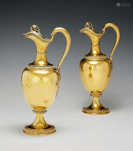 A PAIR OF VICTORIAN SILVER GILT OVOID CLARET JUGS BY GARRARD...