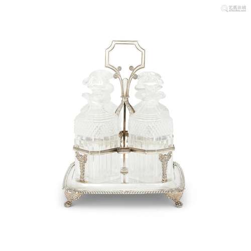 A GEORGE IV SILVER ROUNDED SQUARE FOUR BOTTLE DECANTER STAND...