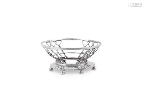 A LATE VICTORIAN SILVER WIREWORK BOWL HOLDER BY OMAR RAMSDEN...