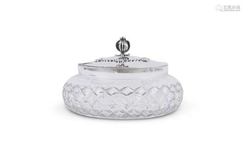 A SILVER LIDDED CUT GLASS POWDER JAR BY OMAR RAMSDEN