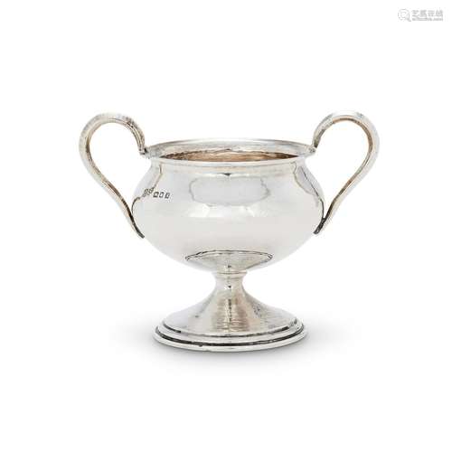 AN ARTS AND CRAFTS HAMMERED SILVER TWIN HANDLED CUP BY OMAR ...