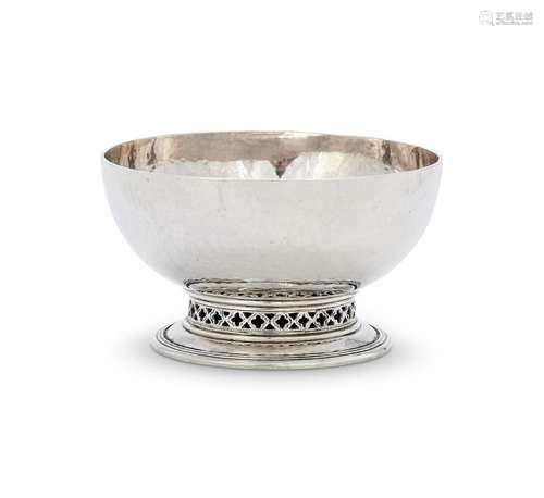 AN ARTS AND CRAFTS HAMMERED SILVER SMALL CIRCULAR BOWL BY OM...