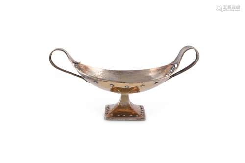 AN ARTS AND CRAFTS HAMMERED SILVER GILT OVAL PEDESTAL BOWL B...