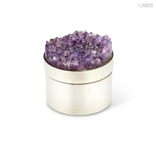 A SILVER CYLINDRICAL BOX WITH AN AMETHYST GEODE COVER BY STU...