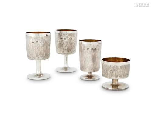 FOUR CONFORMING PIECES OF BARK EFFECT SILVER BY GERALD BENNE...