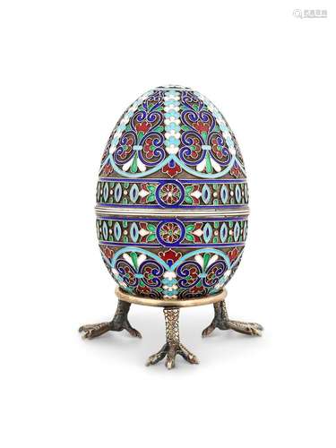 A RUSSIAN SILVER GILT AND CLOISONNÉ ENAMEL EGG BY GUSTAV KLI...