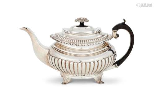 AN INDIAN COLONIAL SILVER OBLONG BALUSTER TEA POT BY HAMILTO...