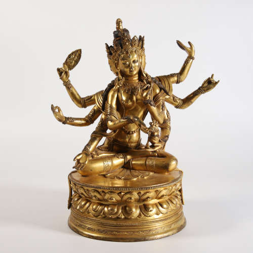 A Gilt Bronze Figure of Eight-Armed Buddha