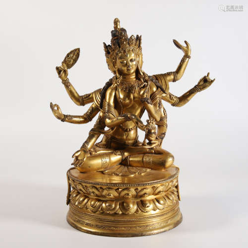 A Gilt Bronze Figure of Eight-Armed Buddha