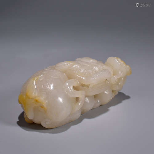 A Carved Hetian Jade Lion Group Ornament