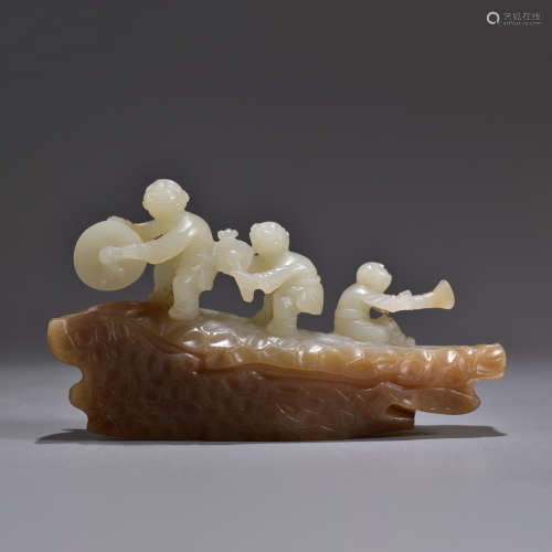 A Carved Hetian Jade Cameo Boy and Drum Ornament