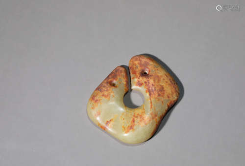 A Carved Russet Jade Pendant