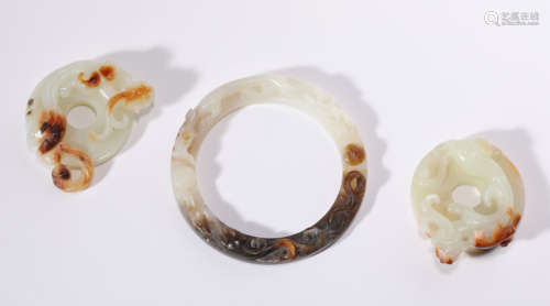 A Set of Three Russet Jade Pendants