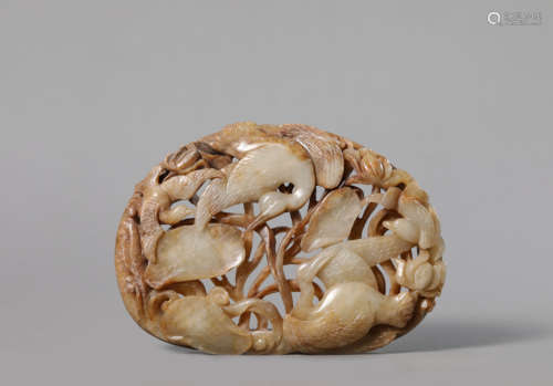 A Carved Russet Jade Flower and Bird Applique