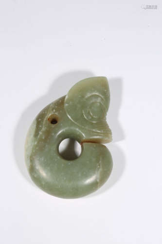 A Carved Celadon Jade Dragon Ornament