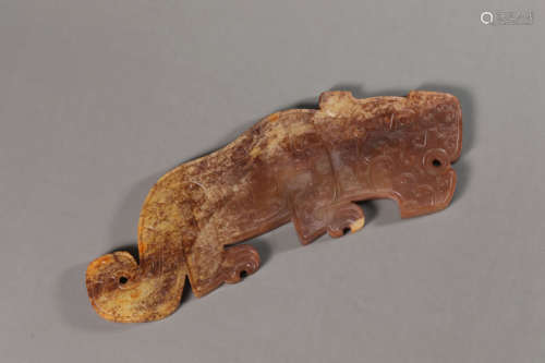 A Carved Brownish Jade Dragon Huang Ornament