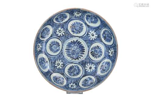 A blue and white porcelain deep charger, decorated with flow...